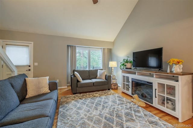 753 Edge Hill Dr, Woodland Park, CO 80863 - living area featuring wood finished floors and high vaulted ceiling