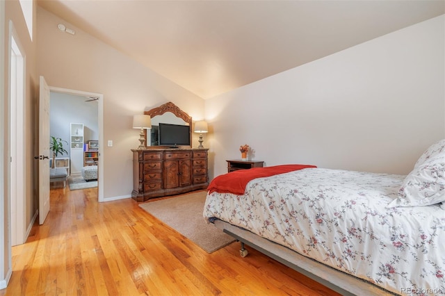 753 Edge Hill Dr, Woodland Park, CO 80863 - bedroom featuring light wood-style flooring and vaulted ceiling