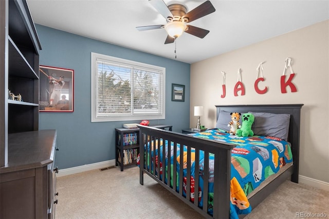 carpeted bedroom featuring visible vents, ceiling fan, and baseboards