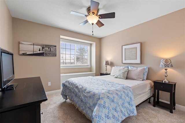 bedroom with baseboards, ceiling fan, and light colored carpet