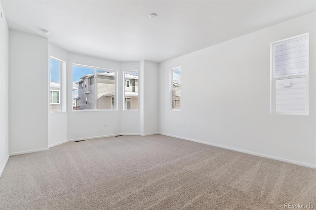 empty room with carpet flooring