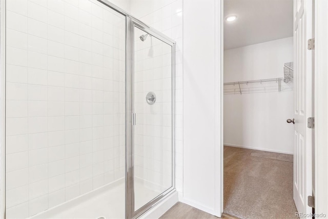 bathroom featuring an enclosed shower