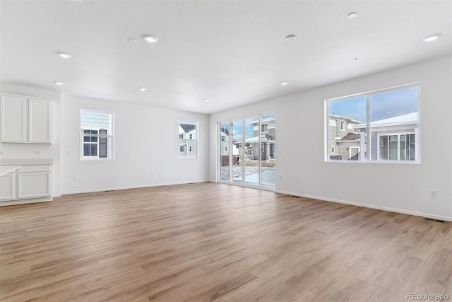 unfurnished living room featuring light wood-type flooring