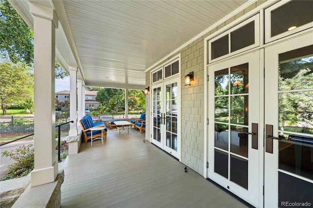 wooden deck with french doors and covered porch