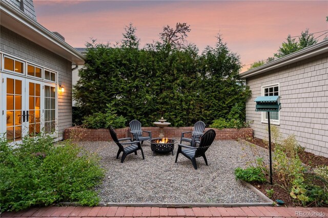 view of patio / terrace featuring a grill and a fire pit