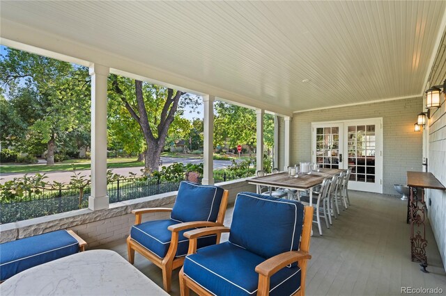 sunroom featuring french doors