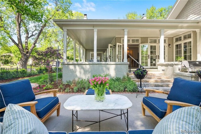 view of patio with fence and grilling area