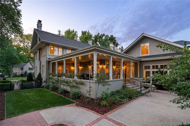 exterior space with a front lawn and a chimney