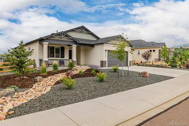 4465 Mesa Top Dr, Monument, CO 80132 - craftsman-style home with a porch, stucco siding, an attached garage, and driveway