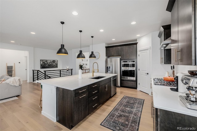 4465 Mesa Top Dr, Monument, CO 80132 - kitchen with light wood finished floors, light countertops, appliances with stainless steel finishes, and recessed lighting
