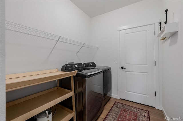 4465 Mesa Top Dr, Monument, CO 80132 - laundry area featuring washer and clothes dryer and light wood-style flooring