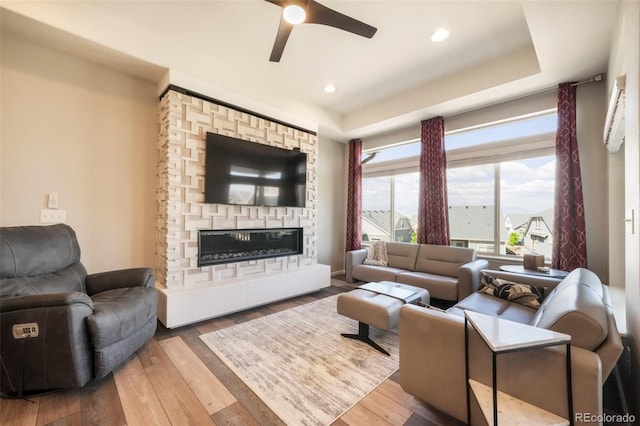 6362 Lythmore Grv, Colorado Springs, CO 80927 - living room featuring ceiling fan, wood finished floors, a fireplace, and recessed lighting
