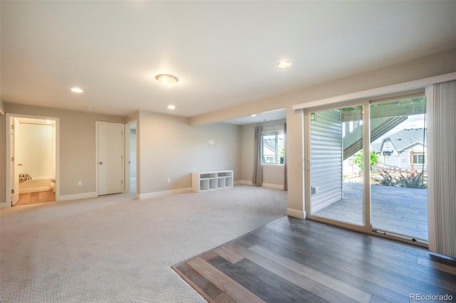 6362 Lythmore Grv, Colorado Springs, CO 80927 - empty room featuring light wood finished floors, baseboards, recessed lighting, and light colored carpet