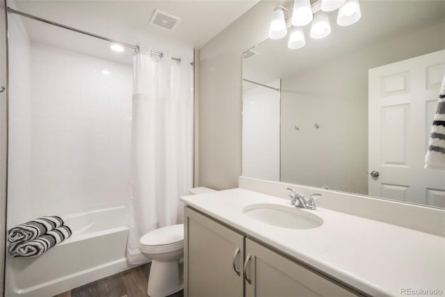 6362 Lythmore Grv, Colorado Springs, CO 80927 - bathroom with toilet, wood finished floors, vanity, and shower / tub combo with curtain