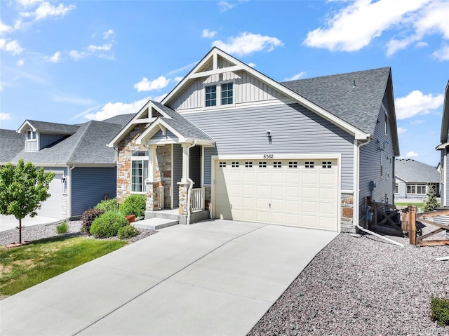 6362 Lythmore Grv, Colorado Springs, CO 80927 - craftsman-style house with stone siding, a garage, board and batten siding, concrete driveway, and roof with shingles