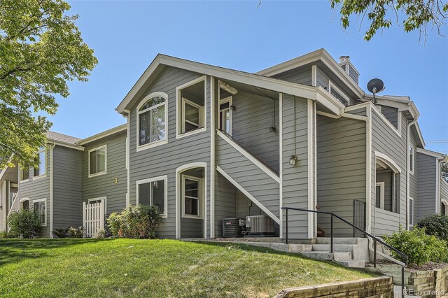 8500 E Jefferson Unit 3C, Denver, CO 80237 - back of house with a lawn and central AC unit