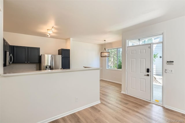 8500 E Jefferson Unit 3C, Denver, CO 80237 - entryway with light wood-type flooring and baseboards