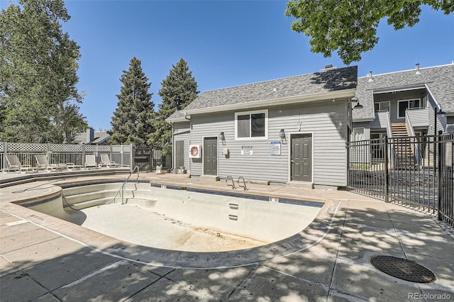 8500 E Jefferson Unit 3C, Denver, CO 80237 - back of property with a patio and a shingled roof