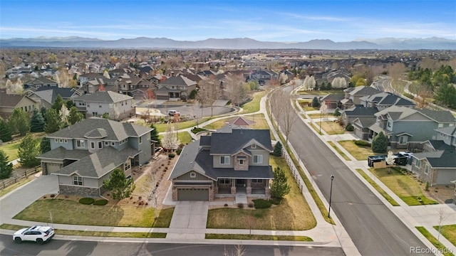 birds eye view of property with a mountain view and a residential view