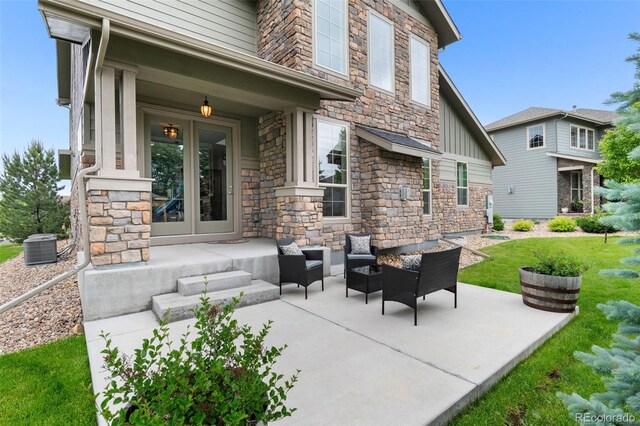 13673 Osage St, Broomfield, CO 80023 - view of patio featuring french doors and central AC unit