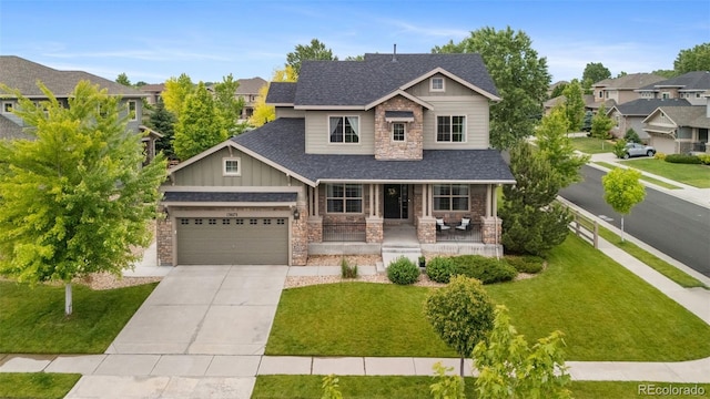 13673 Osage St, Broomfield, CO 80023 - craftsman house featuring a porch, stone siding, concrete driveway, and a garage