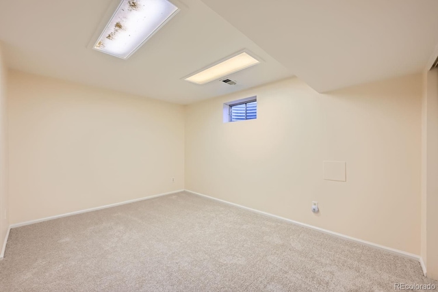 unfurnished room with light carpet