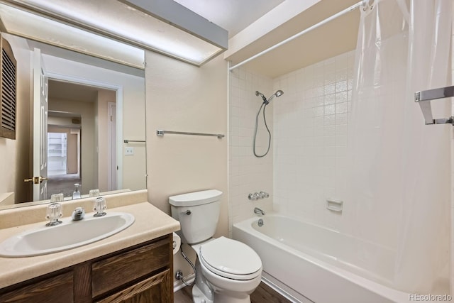 full bathroom with shower / bath combo with shower curtain, vanity, and toilet