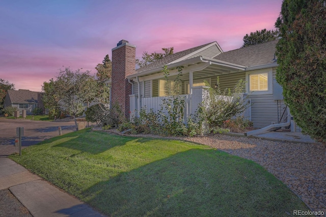 view of front of house with a lawn