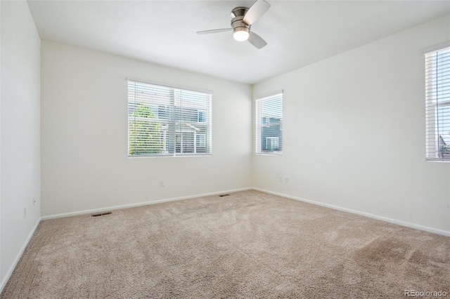 unfurnished room featuring carpet flooring and ceiling fan