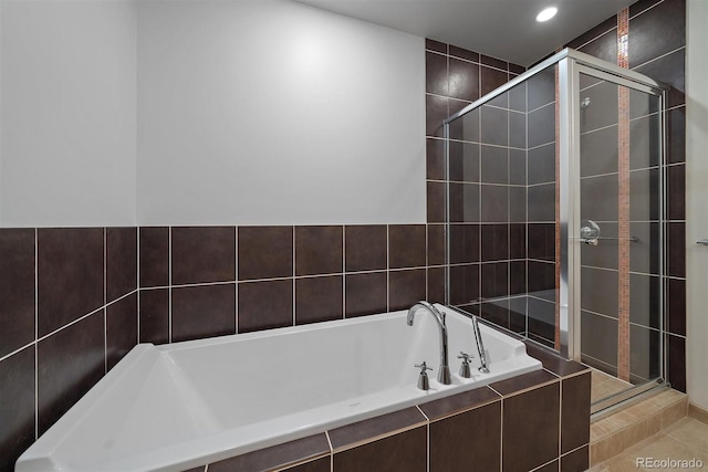 bathroom featuring tile patterned floors and plus walk in shower