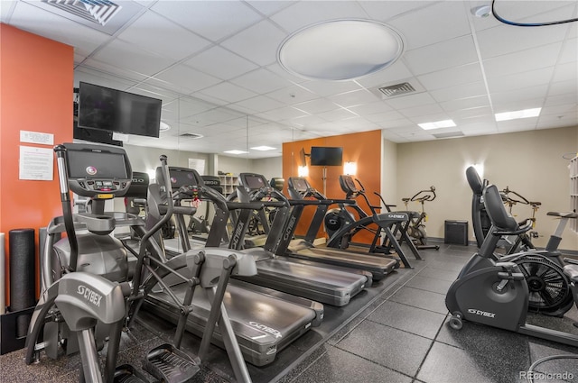 workout area with a paneled ceiling