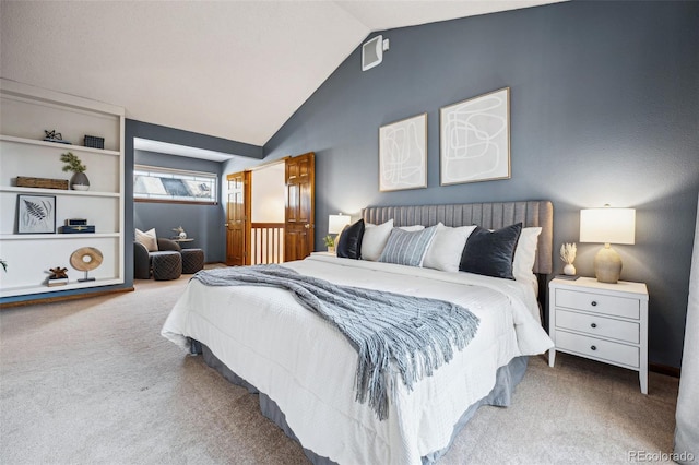 bedroom featuring lofted ceiling and carpet flooring