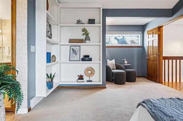 carpeted bedroom featuring beam ceiling