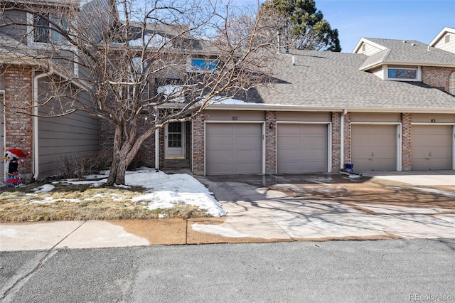 townhome / multi-family property featuring a garage