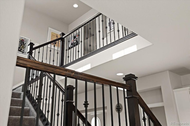 stairs featuring recessed lighting