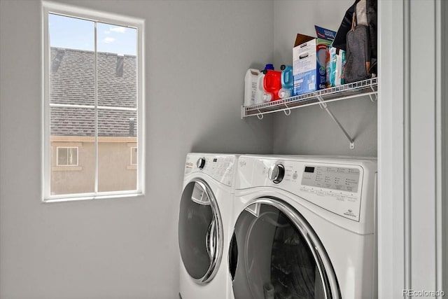 laundry area with separate washer and dryer and laundry area