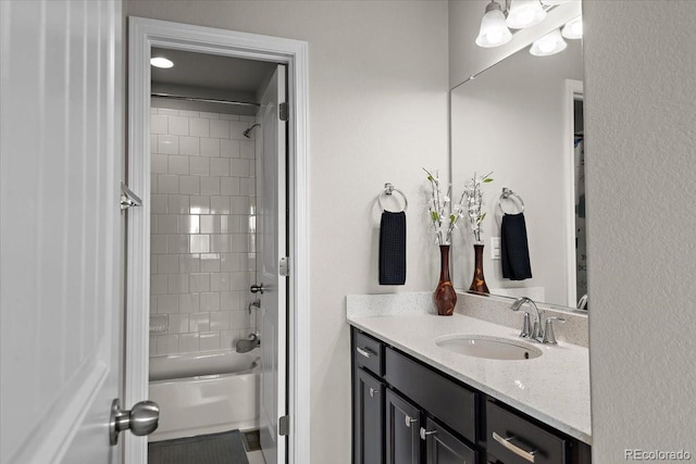 bathroom featuring vanity and shower / tub combination