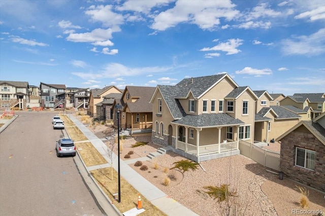 exterior space featuring curbs, a residential view, and sidewalks
