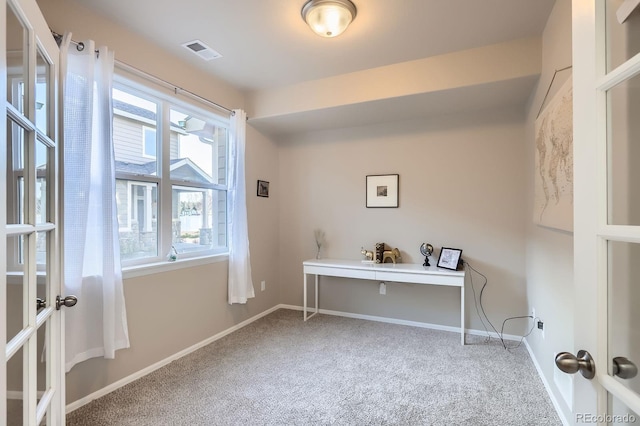 office area featuring carpet, visible vents, and baseboards