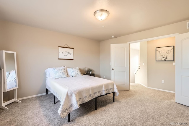bedroom featuring carpet flooring and baseboards