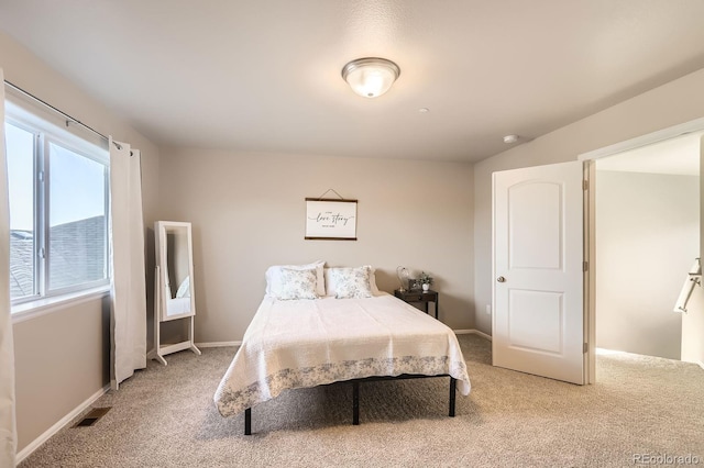 bedroom featuring carpet flooring, baseboards, and visible vents