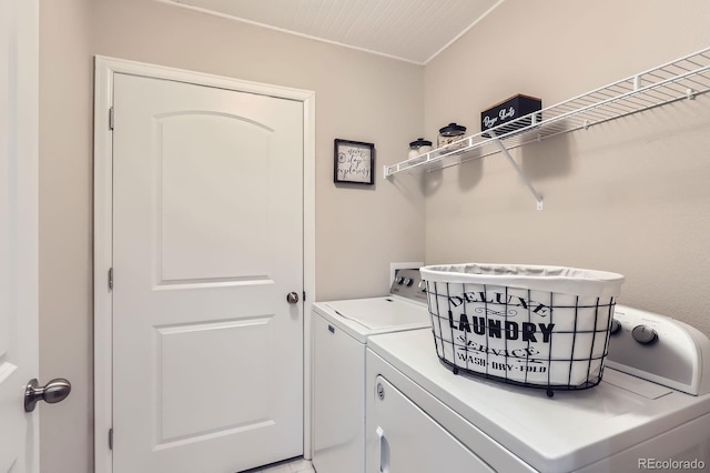washroom featuring laundry area and washer and clothes dryer