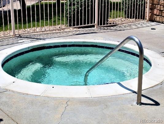 view of pool with a community hot tub