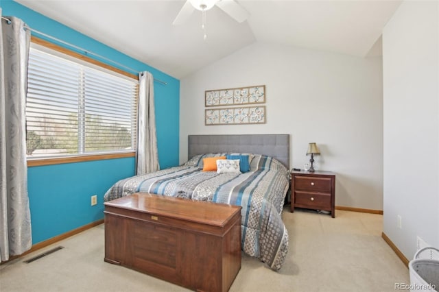 carpeted bedroom featuring baseboards, a ceiling fan, lofted ceiling, and visible vents
