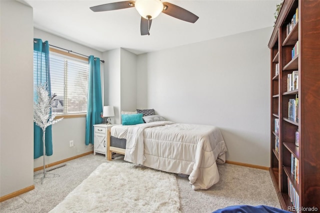 carpeted bedroom with baseboards, ceiling fan, and visible vents