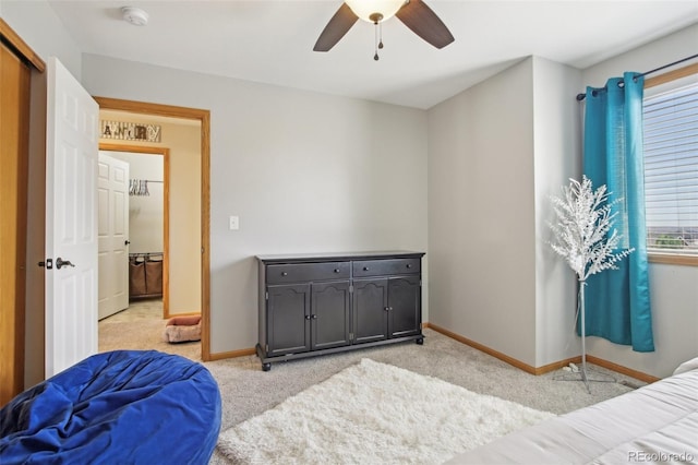 bedroom with baseboards, light carpet, and a ceiling fan