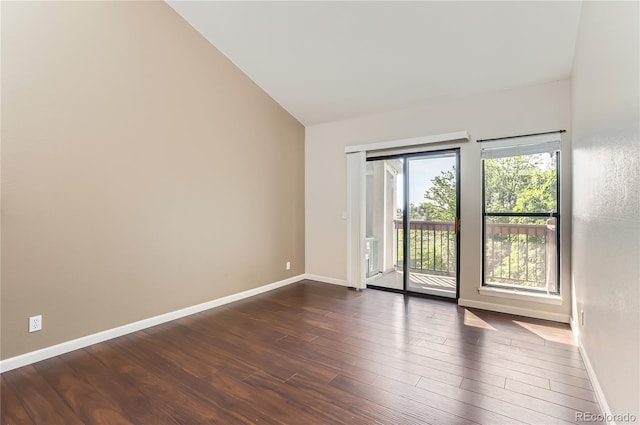8635 Clay St Unit 417, Westminster, CO 80031 - unfurnished room featuring dark wood-style floors, baseboards, and lofted ceiling