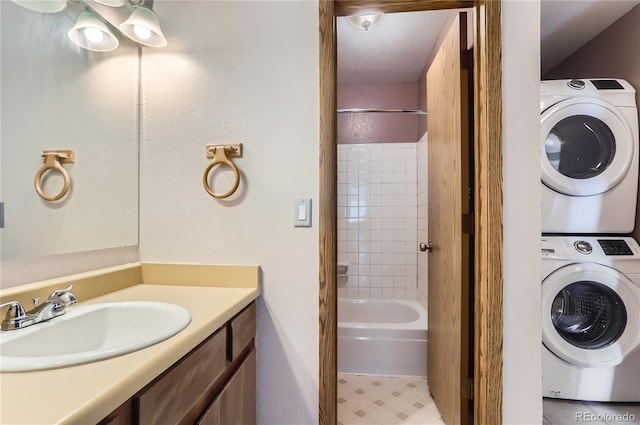 8635 Clay St Unit 417, Westminster, CO 80031 - bathroom featuring stacked washing machine and dryer, vanity, and shower / washtub combination