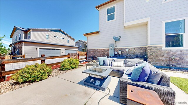 10016 Hough Pt, Parker, CO 80134 - view of patio with an outdoor living space and a garage