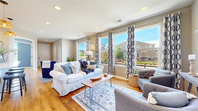 10016 Hough Pt, Parker, CO 80134 - living room featuring light wood-type flooring, recessed lighting, and baseboards